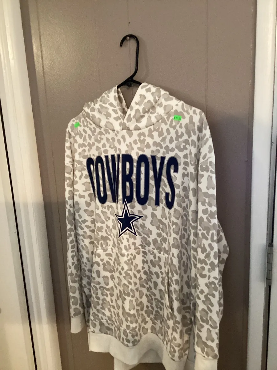 Gray leopard-print Cowboys hoodie on a hanger