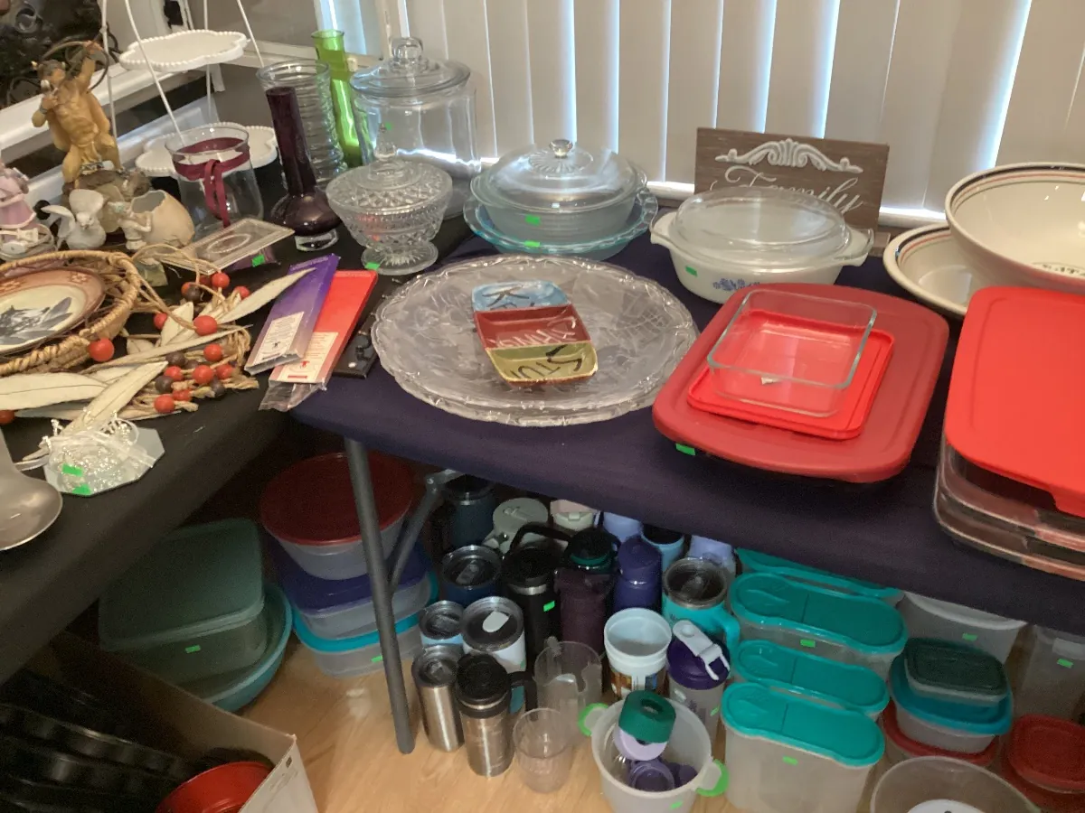 Table of dishes, serving platters and food storage containers
