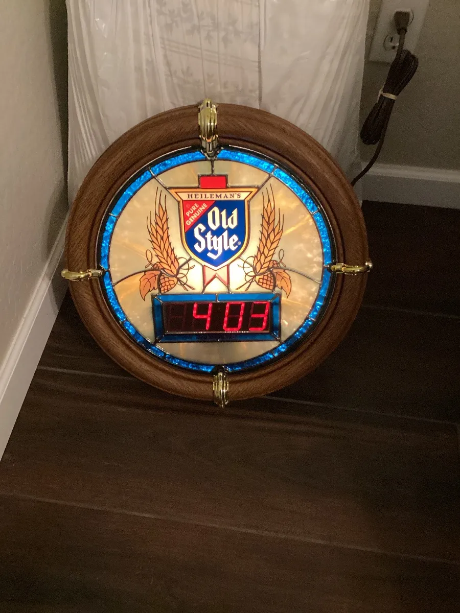 Round Old Style beer clock with a digital time display