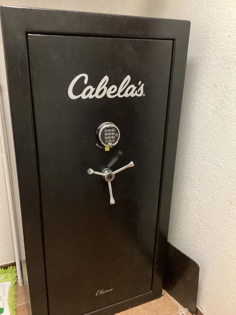 Black Cabela's safe with a dial lock and spoke handle